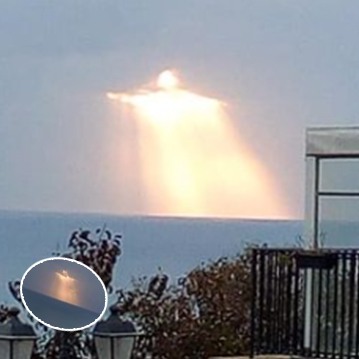 Man captures “Christ the Redeemer” glowing through the clouds